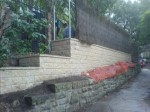 Retaining wall and brush fence All Day Fencing 1300 633 623
